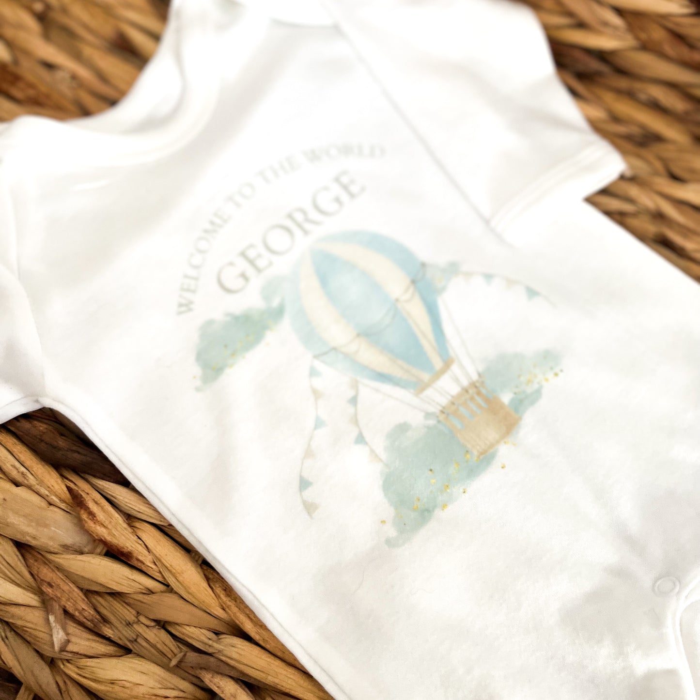 Personalised New Baby Boy Sleepsuit. Welcome to the World Hot Air Balloon